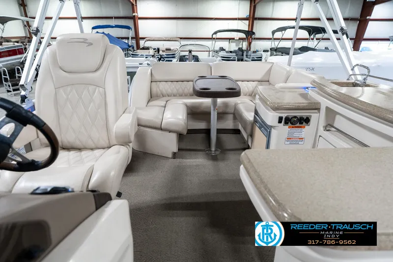 Slide: The Image of Interior of 2014 Bennington 2250 RCB pontoon boat with seating and table. - 17