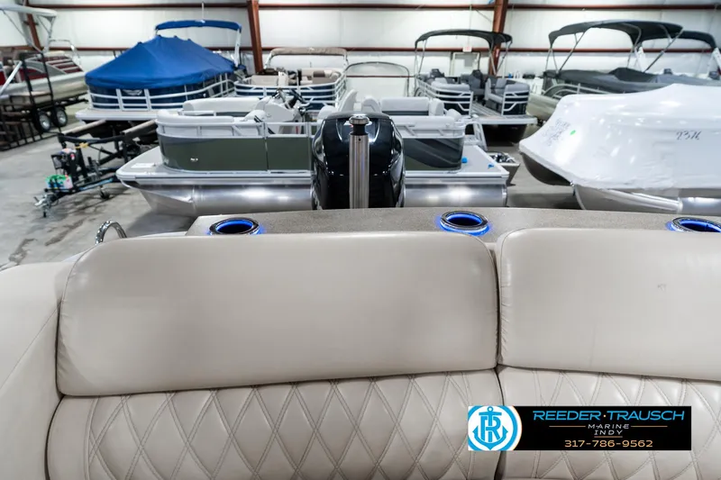 Slide: The Image of 2014 Bennington 2250 RCB pontoon boat in showroom with other boats. - 18
