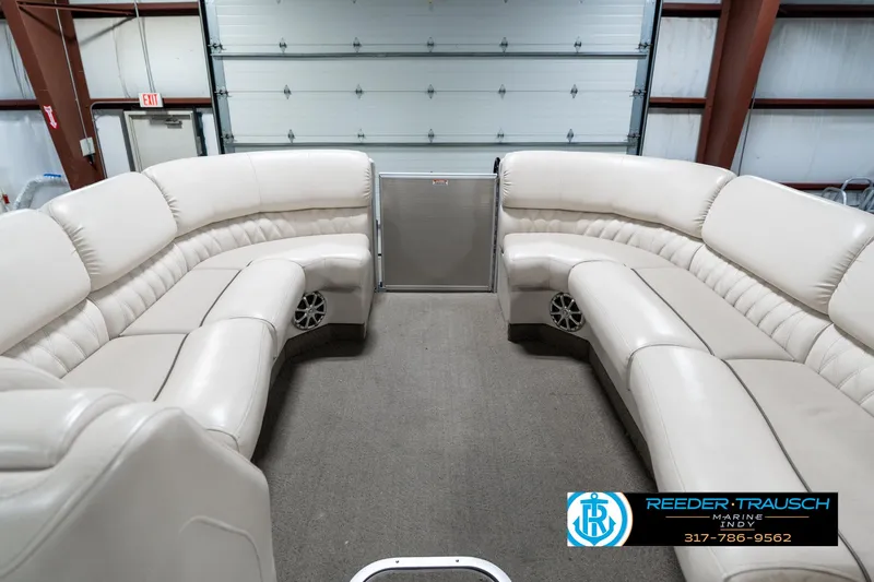 Slide: The Image of 2014 Bennington 2250 RCB boat interior with plush seating in a spacious layout. - 21