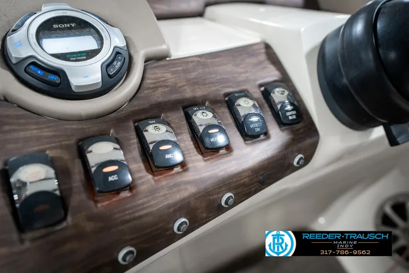 Slide: The Image of Control panel of 2014 Bennington 2250 RCB boat with Sony audio system and switches. - 36