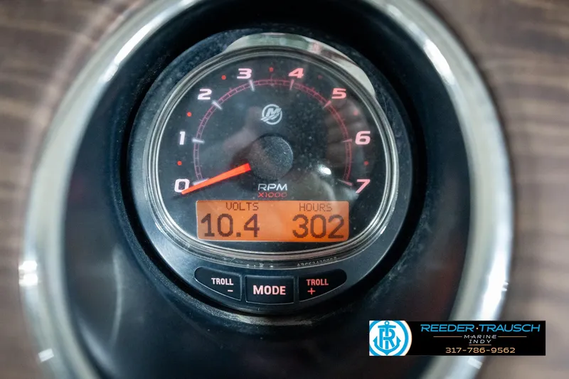 Slide: The Image of Close-up of a 2014 Bennington 2250 RCB tachometer displaying 10.4 volts and 302 hours. - 39