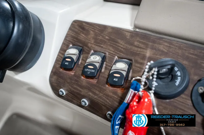 Slide: The Image of Control panel of a 2014 Bennington 2250 RCB boat with ignition keys. - 41