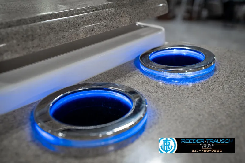 Slide: The Image of LED-lit cup holders on a 2014 Bennington 2250 RCB boat. - 49