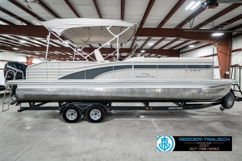 Slide: The Image of 2014 Bennington 2250 RCB pontoon boat on trailer in indoor showroom. - 7