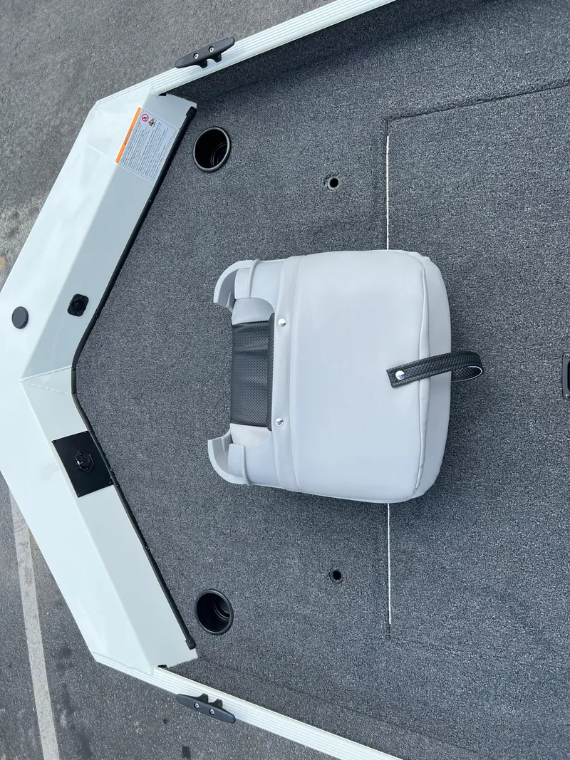 Slide: The Image of 2024 Crestliner 1700 Storm boat interior with gray carpet and white seat. - 10