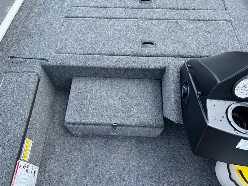 Slide: The Image of 2024 Crestliner 1700 Storm boat interior with gray carpet and control panel. - 4