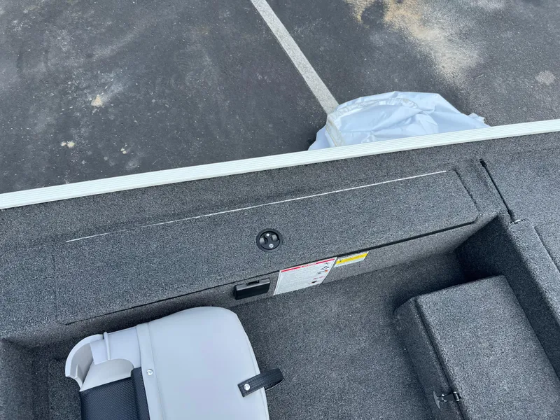 Slide: The Image of 2024 Crestliner 1700 Storm boat interior with seating and storage compartments. - 5