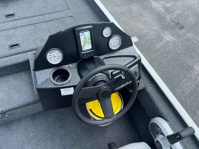Slide: The Image of 2024 Crestliner 1700 Storm boat dashboard with steering wheel and gauges. - 7