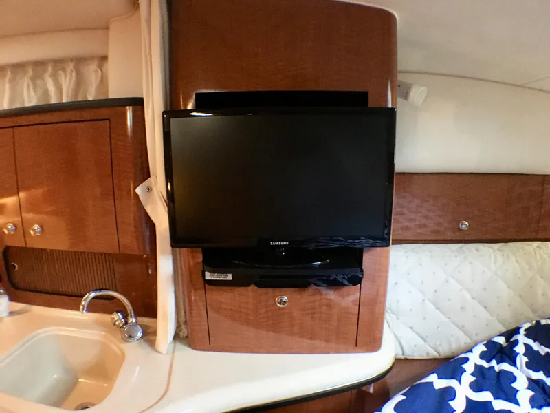 Slide: The Image of Interior of 2002 Sea Ray 320 Sundancer with TV and sink. - 14