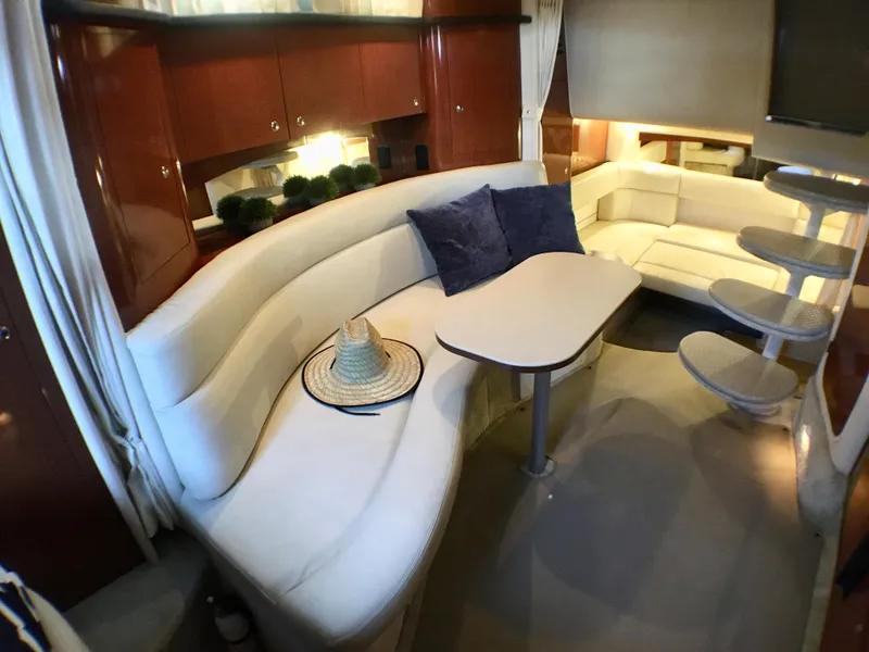 Slide: The Image of Luxurious interior of 2002 Sea Ray 320 Sundancer with plush seating and elegant decor. - 24