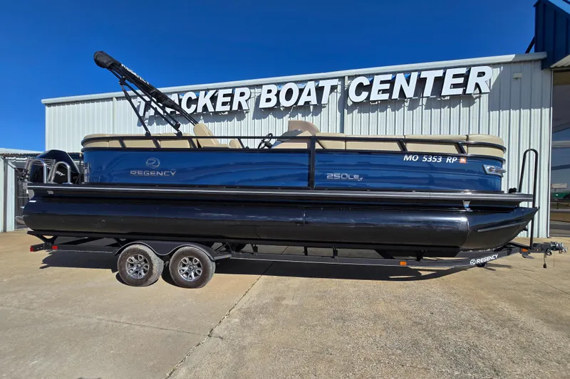 The Image of 2023 Regency 250 LE3 pontoon boat on trailer at Tracker Boat Center. - 1