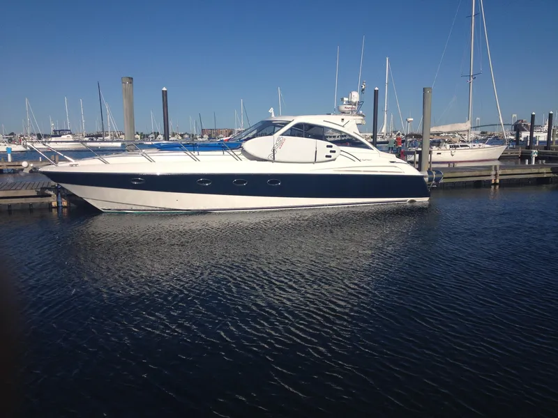 Slide: The Image of 2007 Windy Typhoon 43 yacht docked in a marina under clear blue skies. - 0