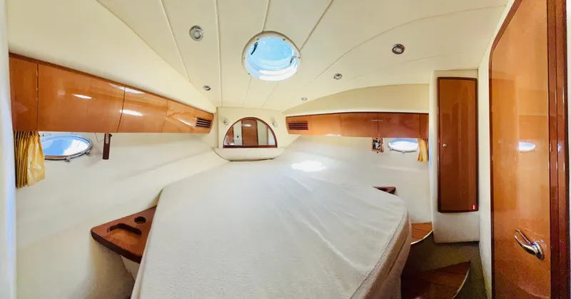 Slide: The Image of Luxurious cabin interior of 2007 Windy Typhoon 43 yacht, featuring elegant wood finishes. - 10