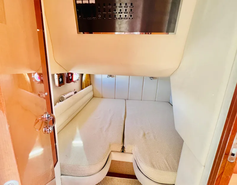 Slide: The Image of Cozy cabin interior of 2007 Windy Typhoon 43 yacht with twin beds. - 13