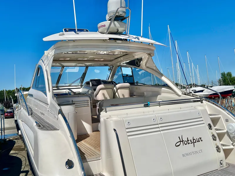 Slide: The Image of Luxury Windy Typhoon 43 yacht, 2007 model, docked with open cockpit and clear blue sky. - 2