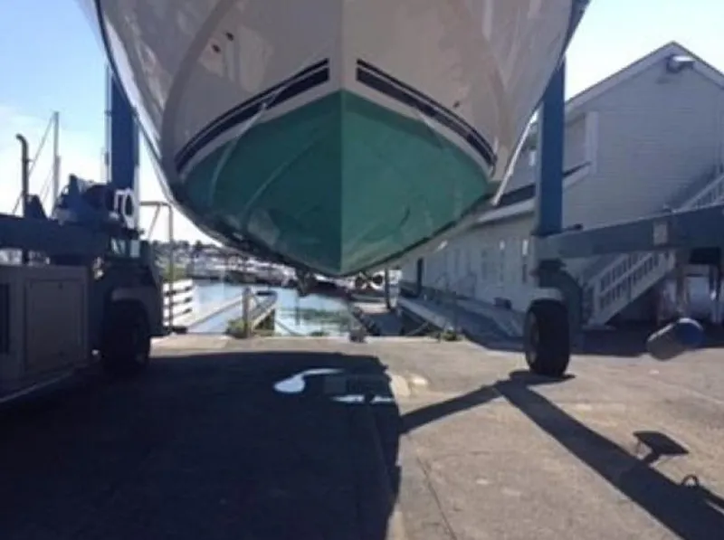 Slide: The Image of 2007 Windy Typhoon 43 boat on a trailer at a marina. - 24