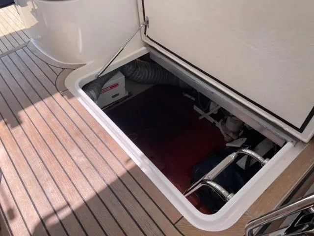 Slide: The Image of Open hatch on 2007 Windy Typhoon 43 boat deck, revealing storage compartment. - 32