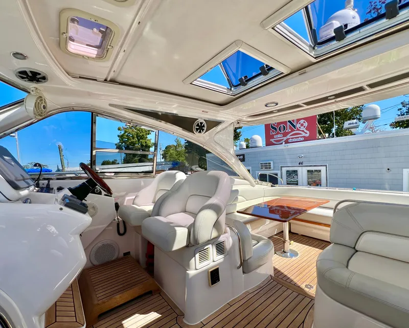 Slide: The Image of Luxurious interior of 2007 Windy Typhoon 43 yacht with plush seating and wooden flooring. - 4