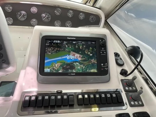 Slide: The Image of Control panel of 2007 Windy Typhoon 43 with navigation display and switches. - 41