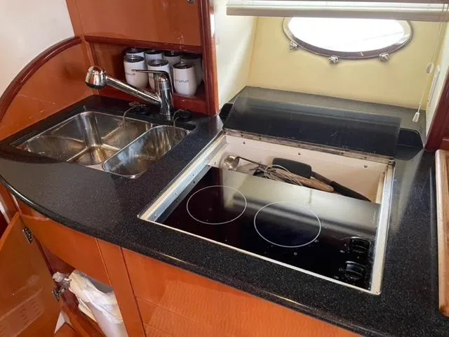 Slide: The Image of 2007 Windy Typhoon 43 yacht kitchen with sink and electric stove. - 42