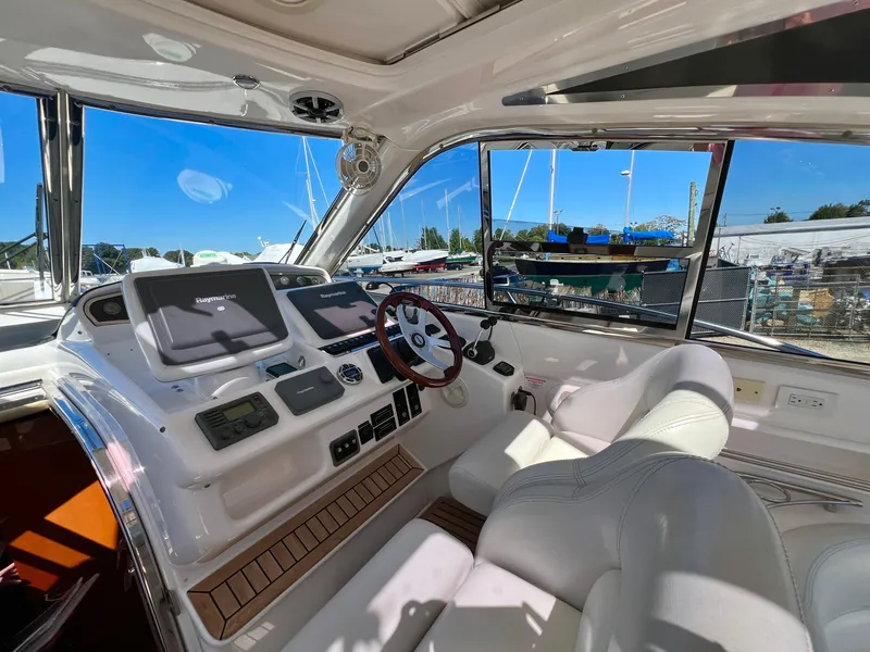 Slide: The Image of Cockpit of 2007 Windy Typhoon 43 with modern navigation equipment and luxurious seating. - 5