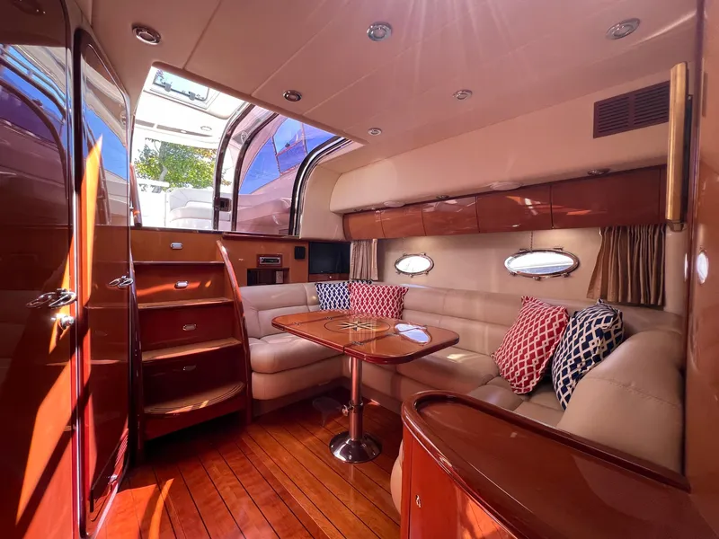 Slide: The Image of Luxurious interior of 2007 Windy Typhoon 43 yacht with elegant seating and wooden finishes. - 6