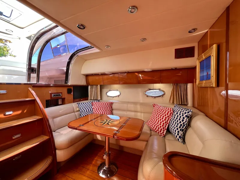 Slide: The Image of Luxurious interior of 2007 Windy Typhoon 43 yacht with elegant seating and wooden finishes. - 7