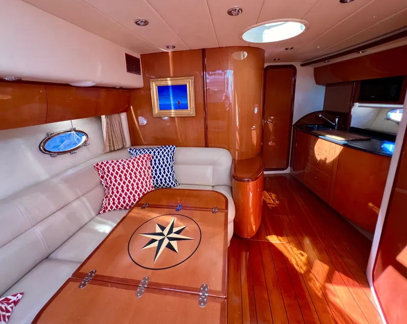 Slide: The Image of Luxurious interior of 2007 Windy Typhoon 43 yacht with elegant wood finishes and plush seating. - 8