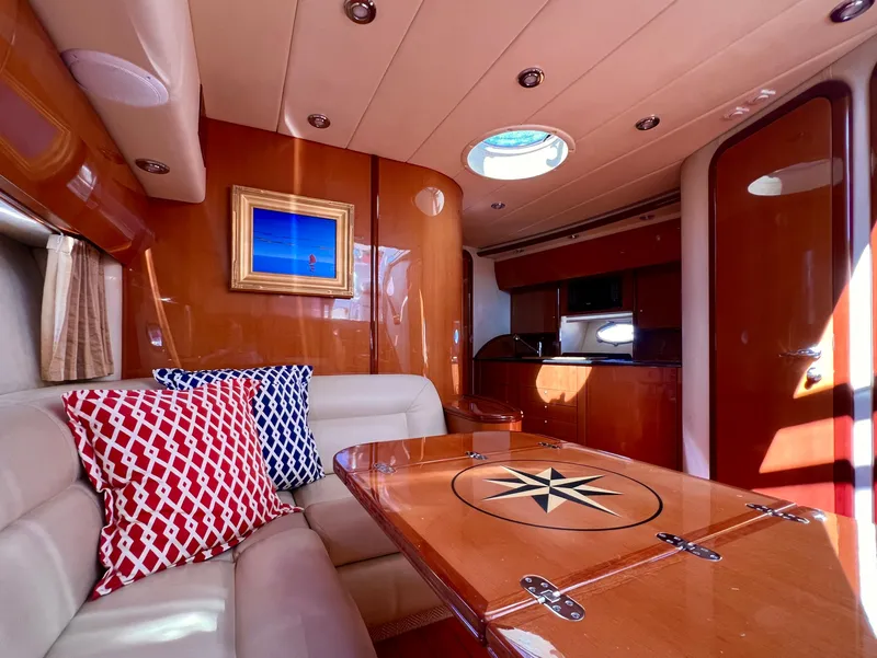 Slide: The Image of Luxurious interior of 2007 Windy Typhoon 43 yacht with elegant wood finishes and plush seating. - 9