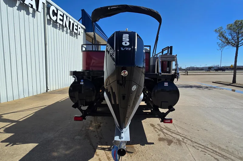 Slide: The Image of 2023 Regency 250 DL3 pontoon boat with powerful V8 engine at dealership. - 3