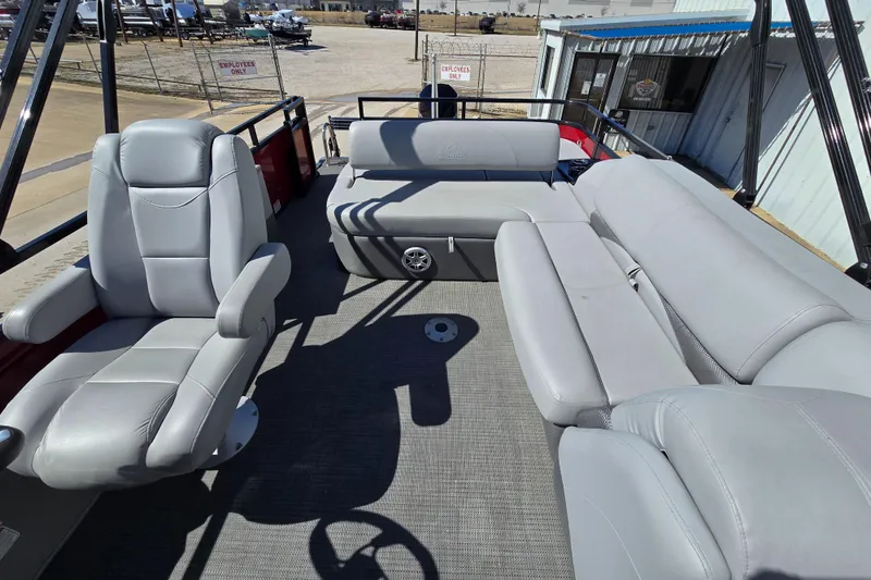 Slide: The Image of 2023 Regency 250 DL3 pontoon boat with spacious seating and modern design. - 6