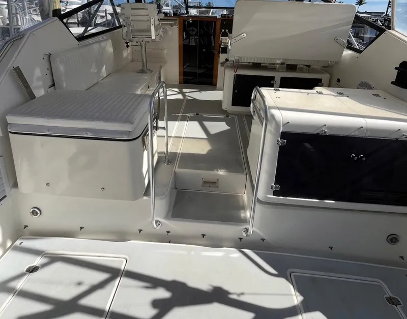 Slide: The Image of 1990 Rampage 36 Sportfisherman boat interior with seating and helm area. - 13