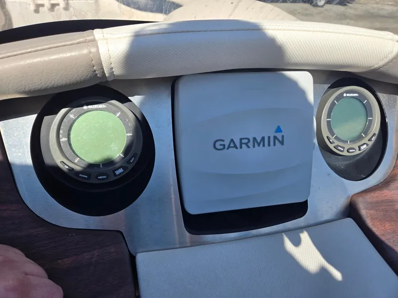 Slide: The Image of Dashboard of 2016 AquaPatio 240 CB with Garmin navigation system. - 12