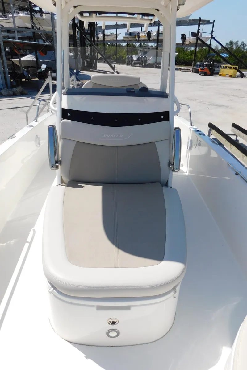 Slide: The Image of 2017 Boston Whaler 270 Dauntless boat interior with cushioned seating. - 33