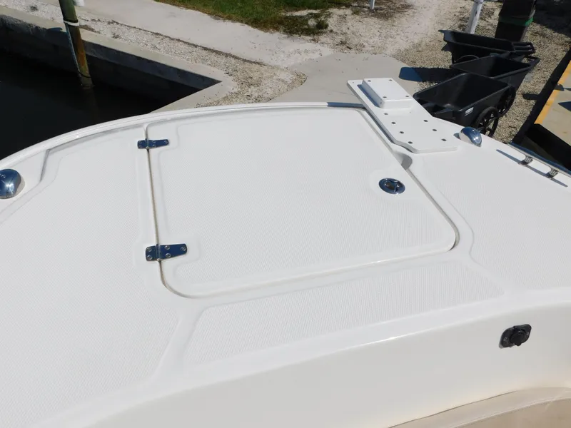 Slide: The Image of 2017 Boston Whaler 270 Dauntless boat deck, featuring a storage hatch and clean design. - 35
