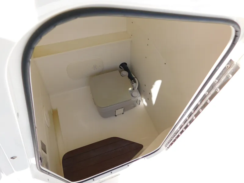Slide: The Image of 2017 Boston Whaler 270 Dauntless boat interior with compact toilet. - 45