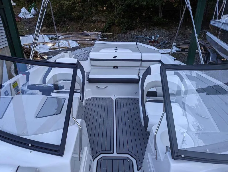 Slide: The Image of 2024 Starcraft SVX 210 IO boat interior with sleek seating and modern design. - 2