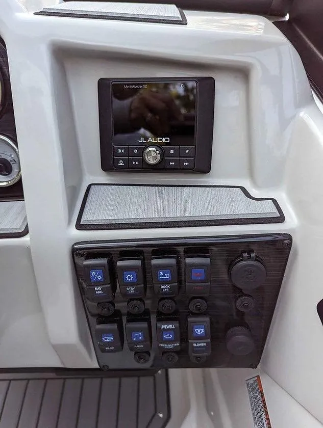 Slide: The Image of 2024 Starcraft SVX 210 IO boat dashboard with JL Audio system and control panel. - 3