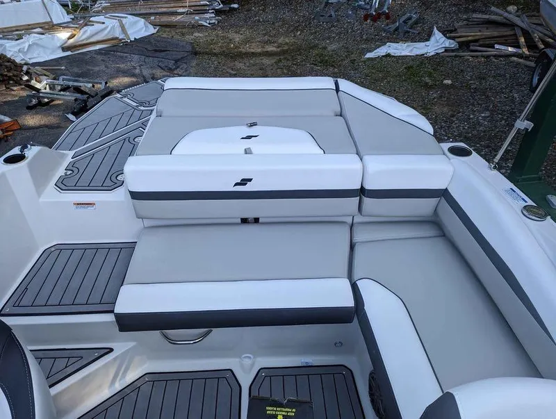 Slide: The Image of 2024 Starcraft SVX 210 IO boat interior with gray and white seating. - 6
