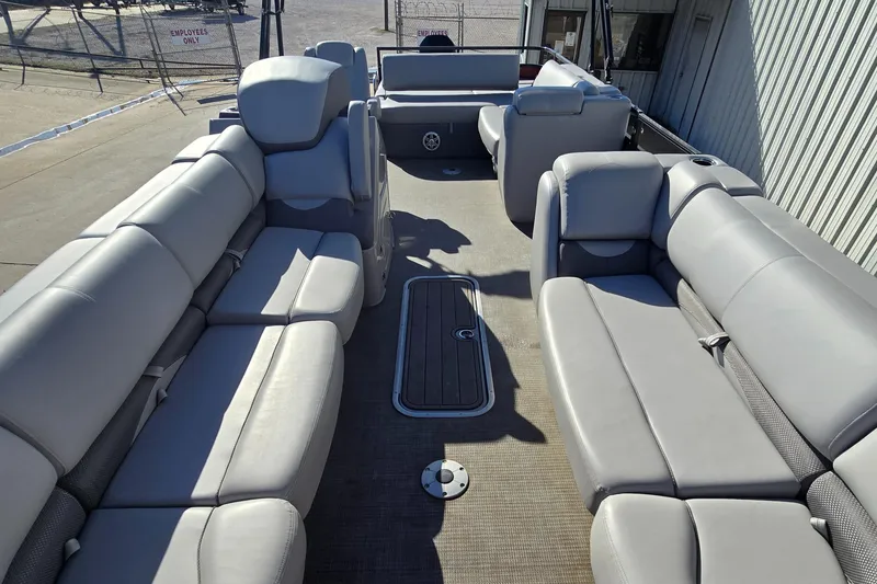 Slide: The Image of 2023 Regency 250 DL3 pontoon boat interior with spacious seating and modern design. - 3