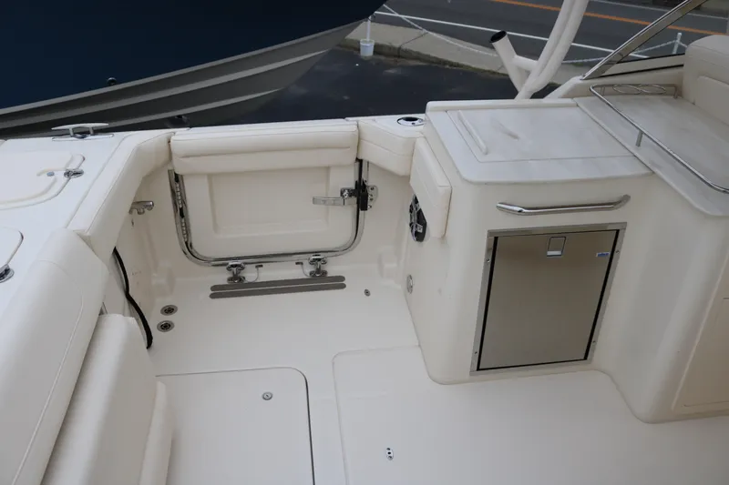 Slide: The Image of 2023 Grady-White Freedom 285 boat interior with seating and storage. - 5