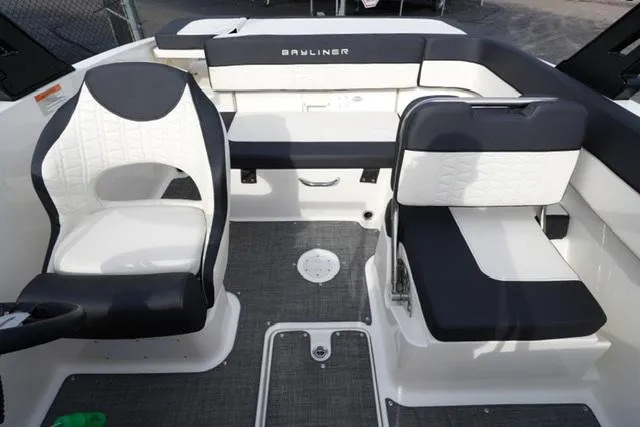 Slide: The Image of 2021 Bayliner VR5 Bowrider I/O interior with black and white seating. - 14