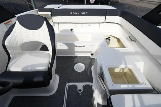 Slide: The Image of 2021 Bayliner VR5 Bowrider I/O interior with seating and storage compartments. - 15