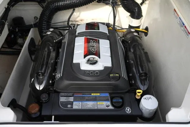 Slide: The Image of 2021 Bayliner VR5 Bowrider I/O engine compartment showcasing a powerful 4.5L Mercury engine. - 16