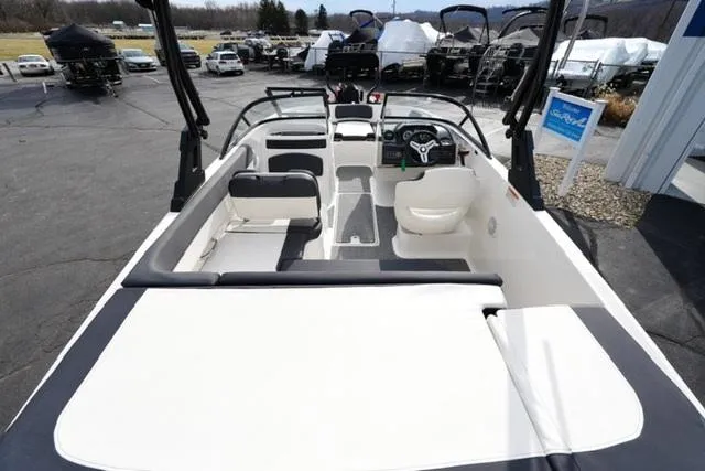 Slide: The Image of 2021 Bayliner VR5 Bowrider I/O interior view, showcasing seating and steering area. - 8