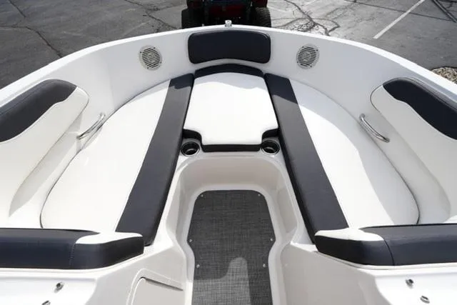 Slide: The Image of 2021 Bayliner VR5 Bowrider I/O interior with cushioned seating and cup holders. - 9