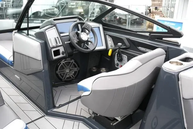 Slide: The Image of 2019 Supra SE 450 boat interior with modern dashboard and steering wheel. - 10