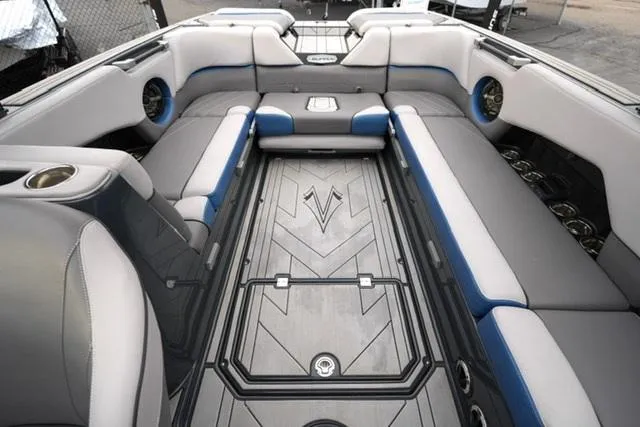 Slide: The Image of 2019 Supra SE 450 boat interior with gray and blue seating. - 12