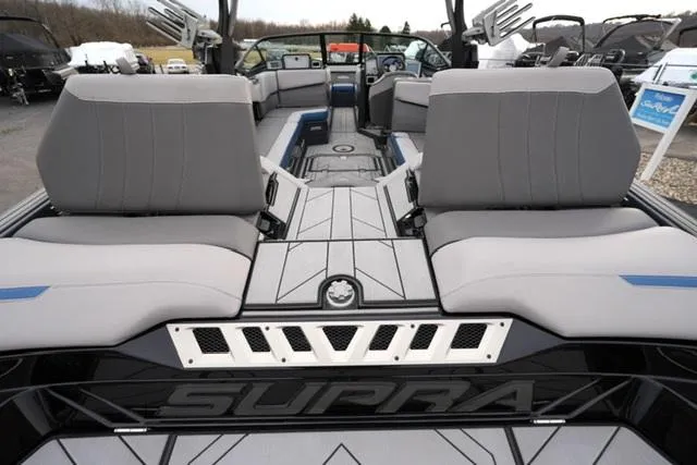 Slide: The Image of 2019 Supra SE 450 boat interior with gray seating and modern design. - 13
