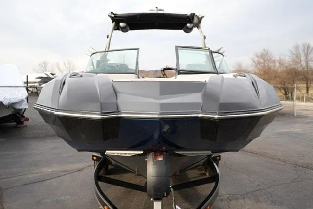 Slide: The Image of 2019 Supra SE 450 boat, front view, parked on a trailer. - 3